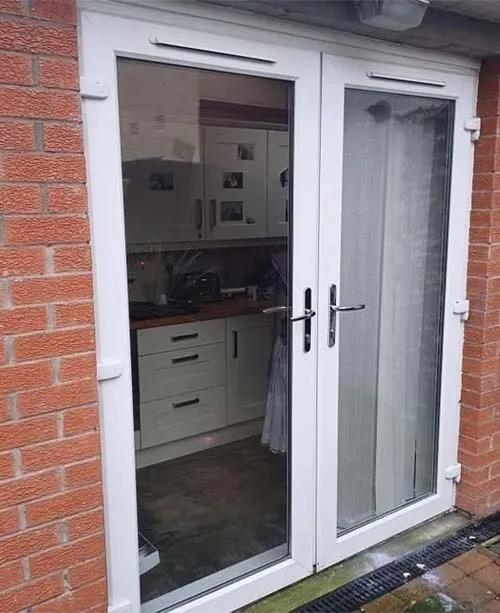 White UPVC patio doors before